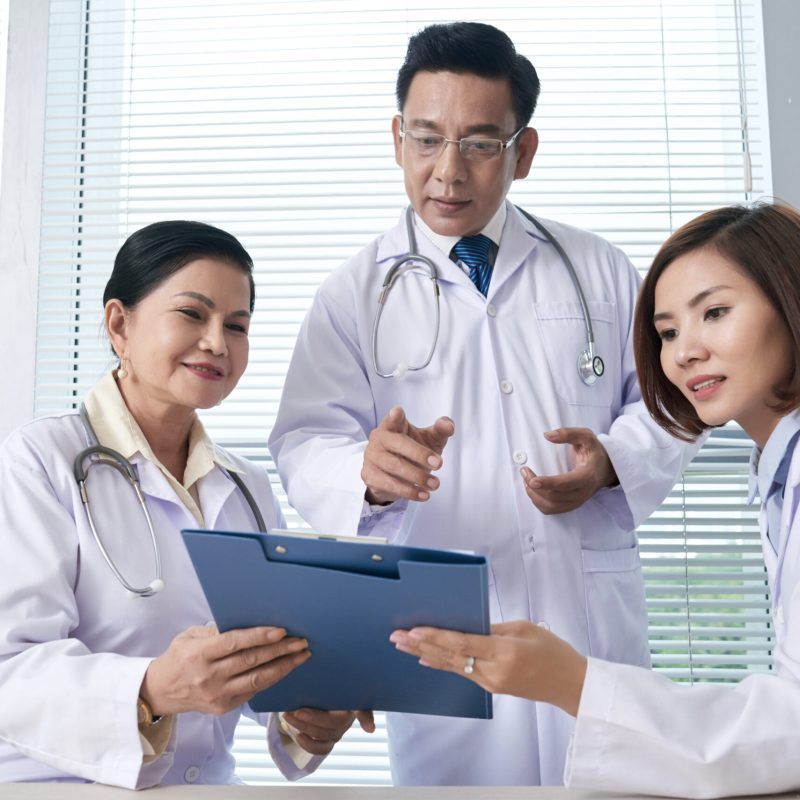 General practitioners showing document to chief doctor